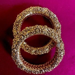 2 thick intricate bangles